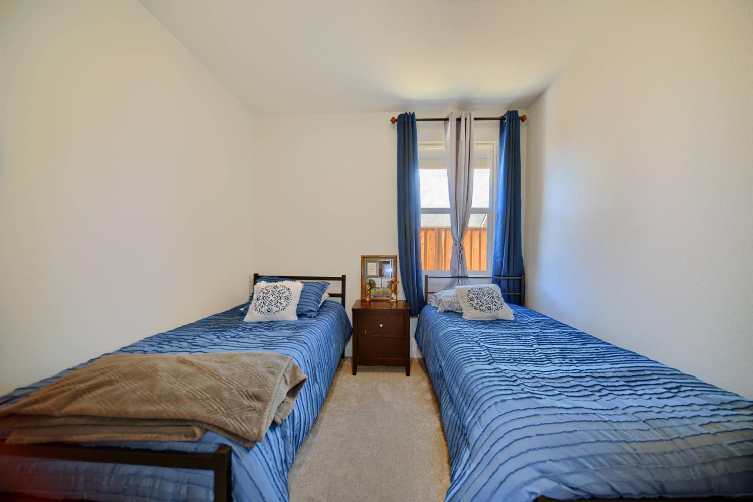 2132 Emerald Rnch Road Patterson, CA 95363 - Photo 17 of 66 a bedroom with two beds and next to a window