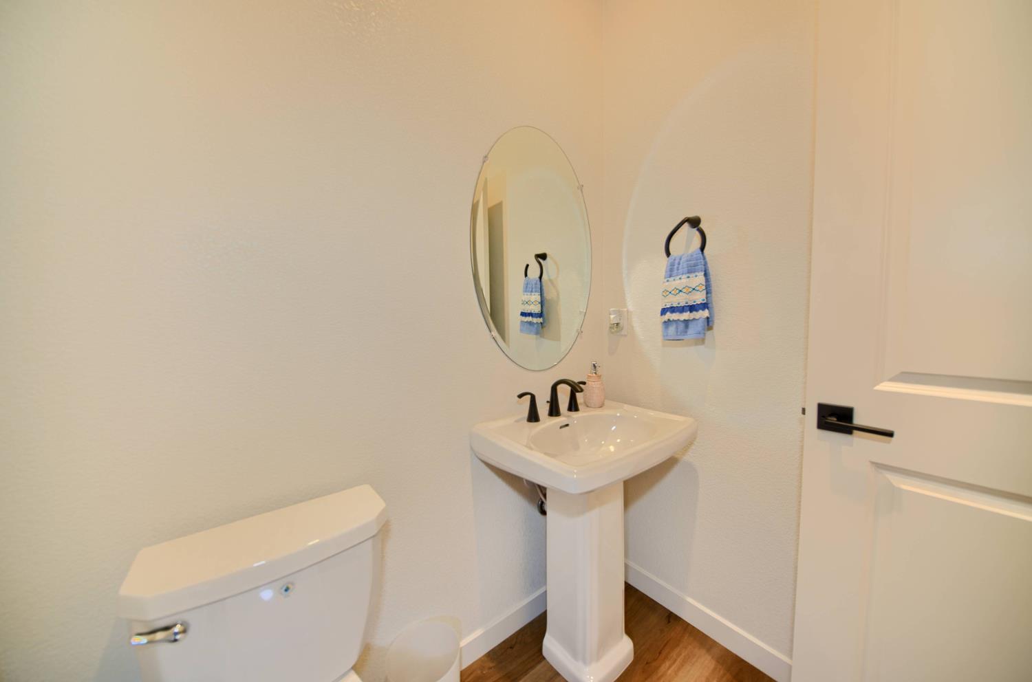 2132 Emerald Rnch Road Patterson, CA 95363 - Photo 21 of 66 a bathroom with a sink mirror and toilet
