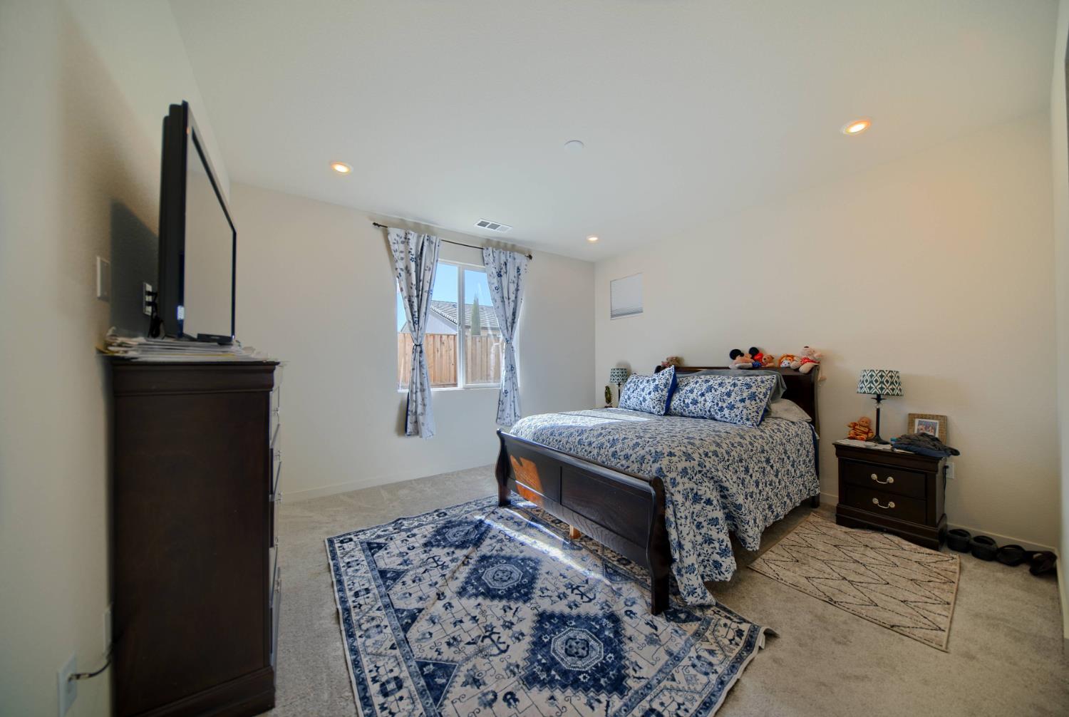 2132 Emerald Rnch Road Patterson, CA 95363 - Photo 24 of 66 a bedroom with a bed and wooden floor