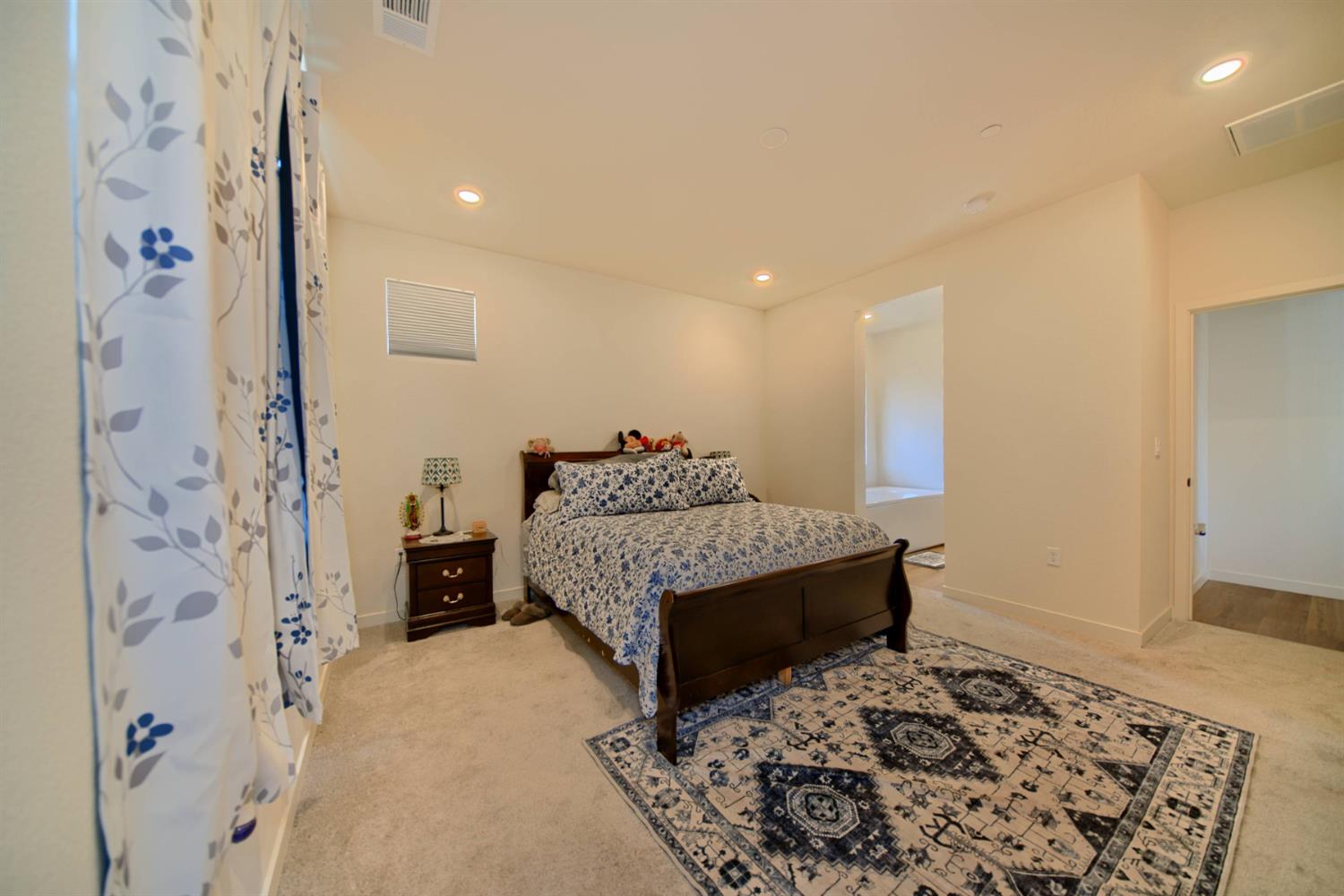 2132 Emerald Rnch Road Patterson, CA 95363 - Photo 25 of 66 a living room with a couch and a rug
