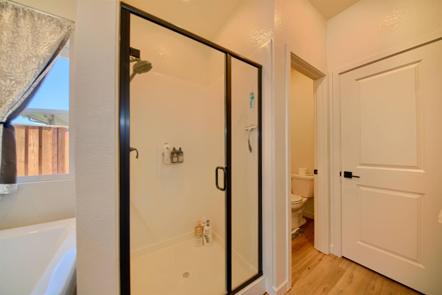 2132 Emerald Rnch Road Patterson, CA 95363 - Photo 28 of 66 a bathroom with a shower and a glass door