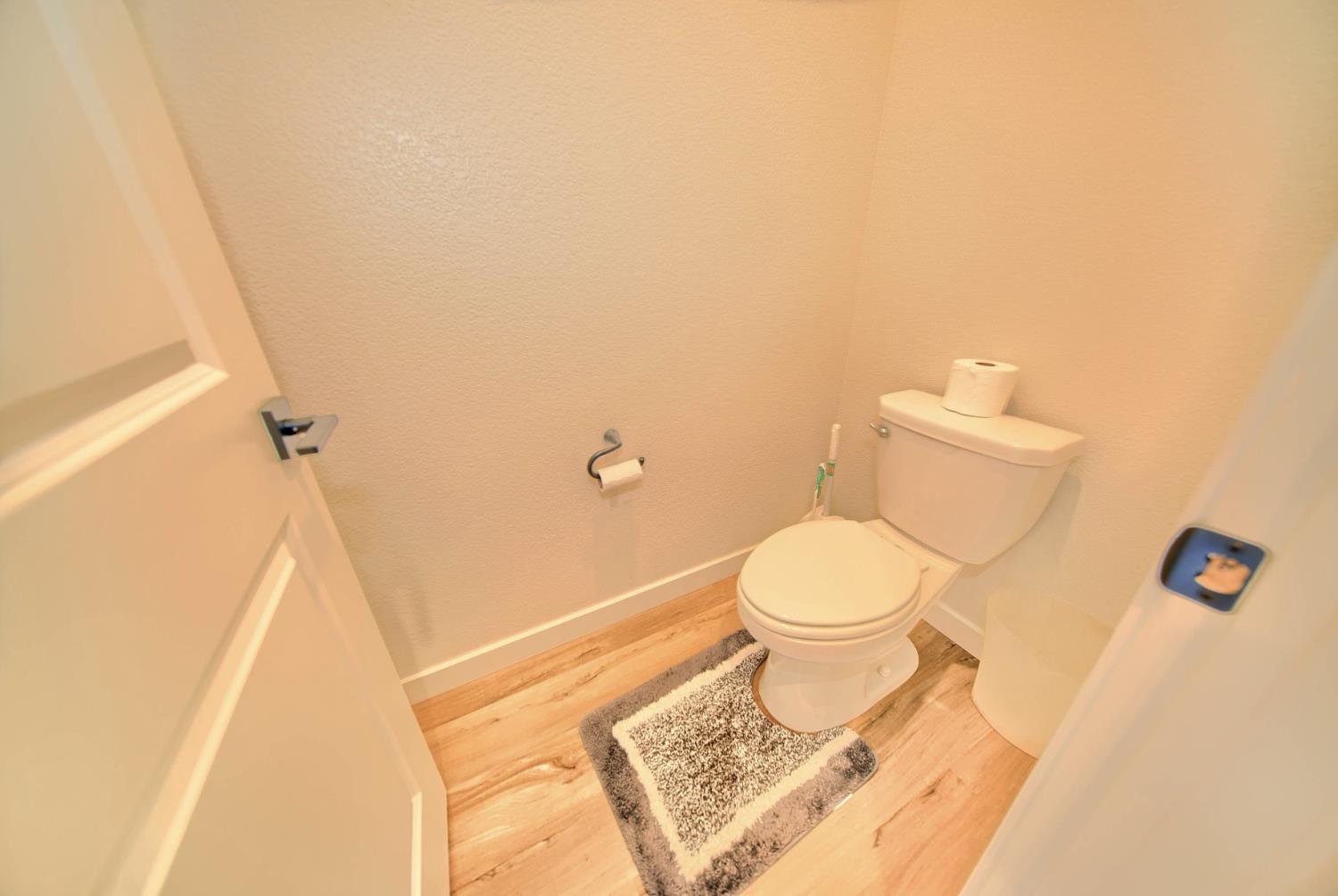 2132 Emerald Rnch Road Patterson, CA 95363 - Photo 31 of 66 a white toilet sitting next to a shower