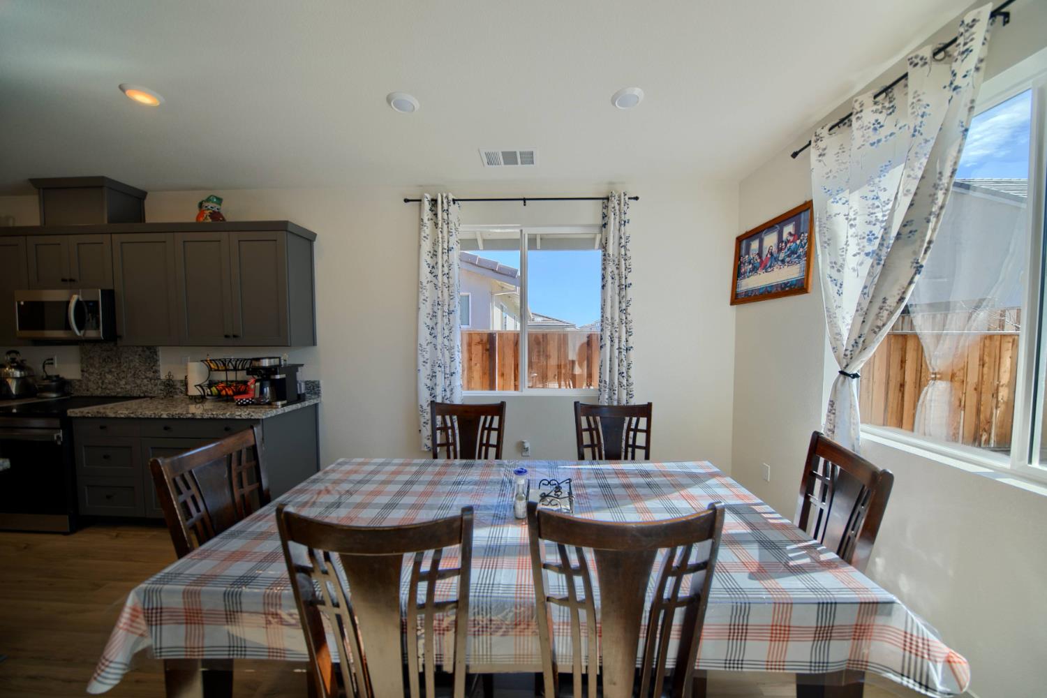 2132 Emerald Rnch Road Patterson, CA 95363 - Photo 41 of 66 a kitchen with stainless steel appliances granite countertop a stove a refrigerator a kitchen island a sink dishwasher and wooden floor