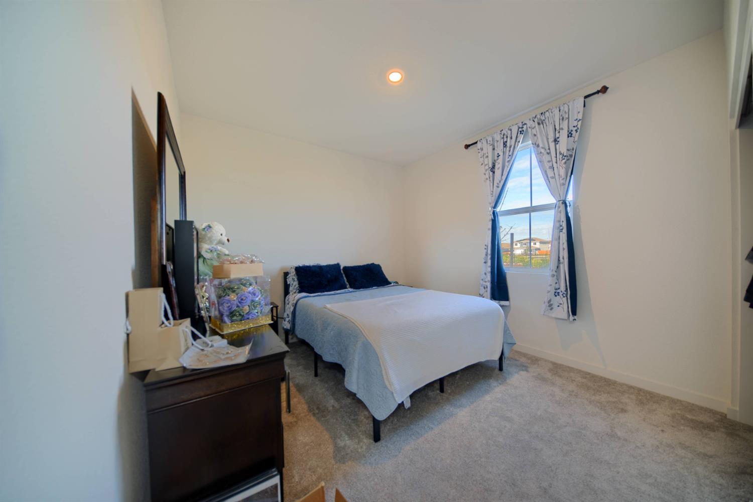 2132 Emerald Rnch Road Patterson, CA 95363 - Photo 9 of 66 a bedroom with a bed and a mirror on dresser