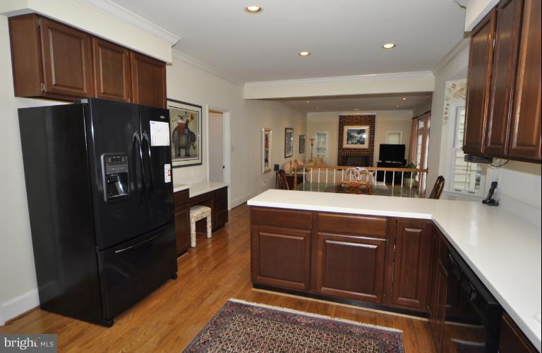 406 Ridge Road Southwest Vienna, VA 22180 - Photo 5 of 28 a kitchen with stainless steel appliances granite countertop a refrigerator and a sink