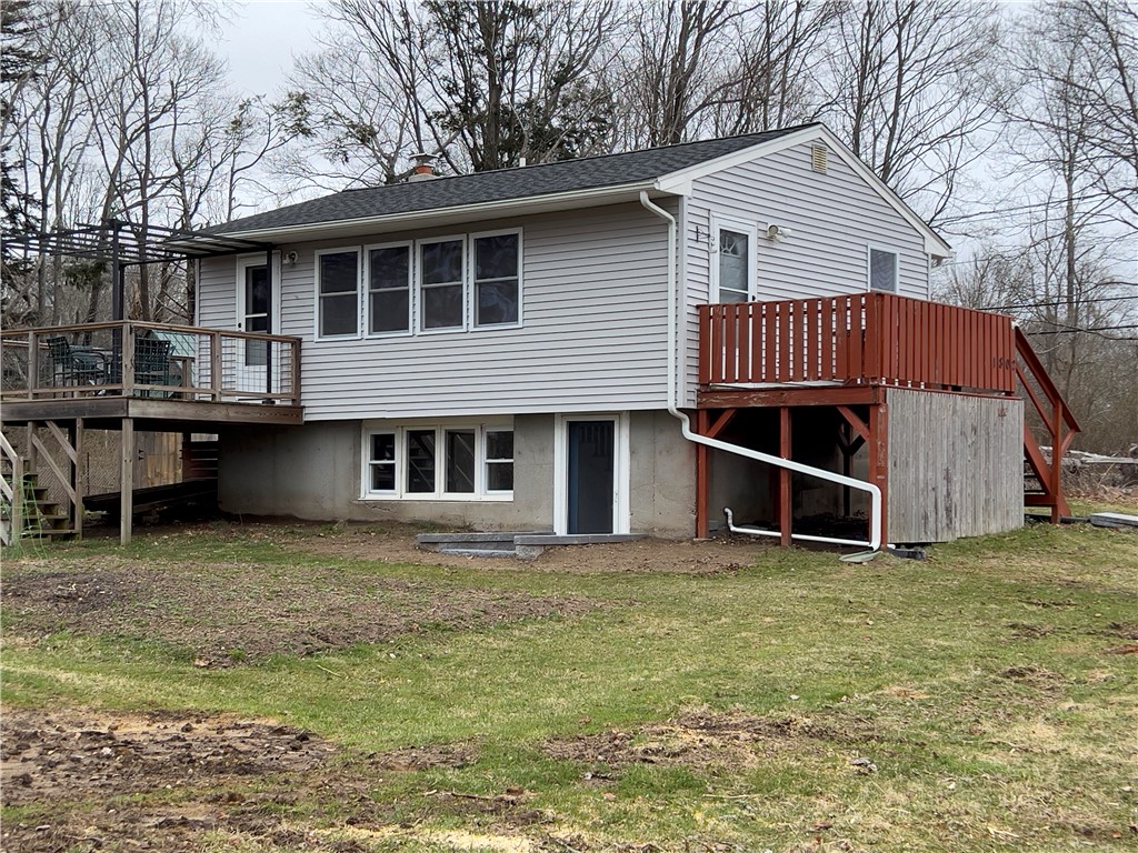 1802 Mooresfield Road South Kingstown, RI 02879 - Photo 1 of 34 Deck off kitchen overlooking the yard and the entry deck to the first floor.. Mooresfield Rd. is on the other side of the house.