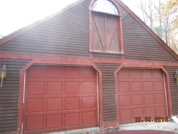 349 Erickson Road Ashby, MA 01431 - Photo 1 of 17 a view of a house with a door and wooden walls