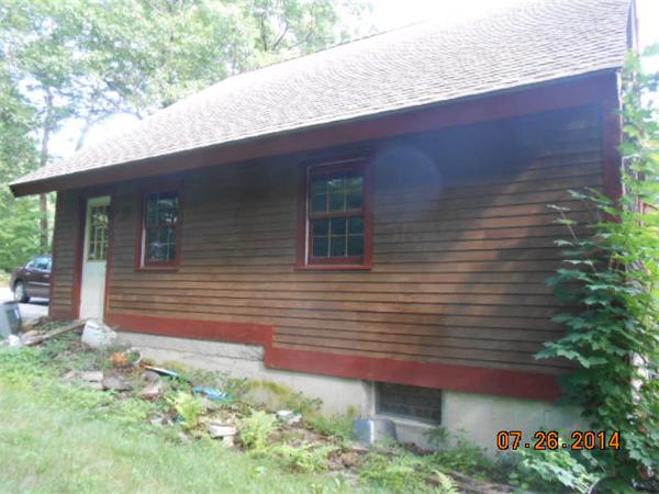 349 Erickson Road Ashby, MA 01431 - Photo 16 of 17 a front view of a house with garden