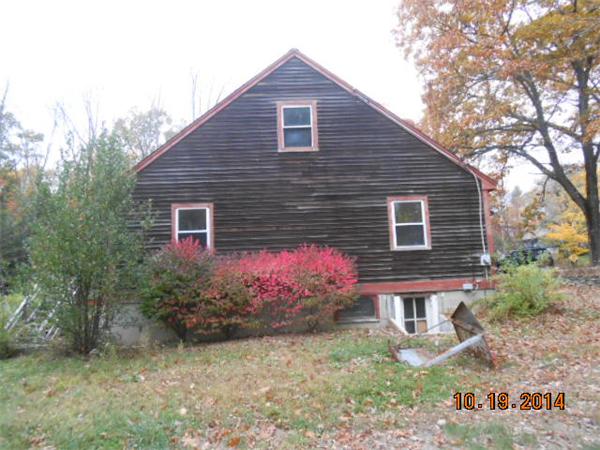 349 Erickson Road Ashby, MA 01431 - Photo 17 of 17 a front view of a house with garden