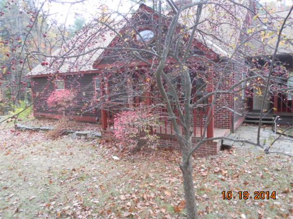 349 Erickson Road Ashby, MA 01431 - Photo 2 of 17 a backyard of a house with lots of green space