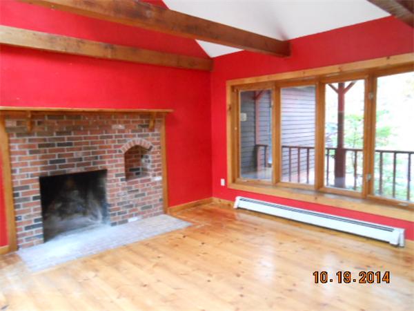 349 Erickson Road Ashby, MA 01431 - Photo 5 of 17 a front view of a fireplace with window