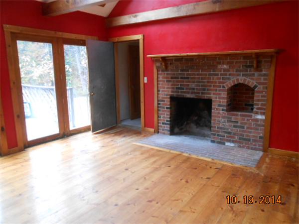 349 Erickson Road Ashby, MA 01431 - Photo 6 of 17 a view of empty room with a fireplace