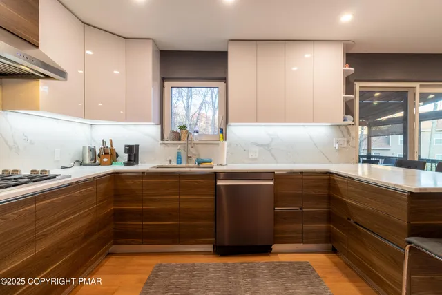 a large kitchen with a table and chairs