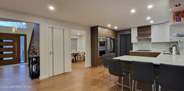 a spacious bedroom with a bed and a window