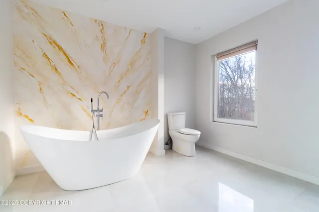 a utility room with sink dryer and washer