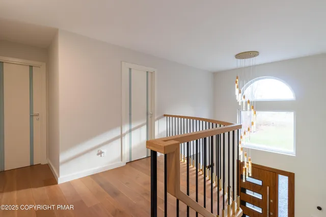a living room with lots of furniture and kitchen view