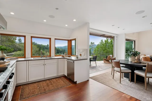 a kitchen with a table and chairs in it