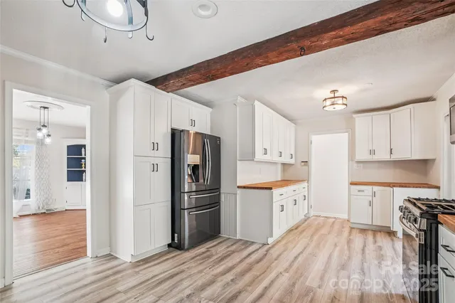 a view of a bedroom with washer and dryer