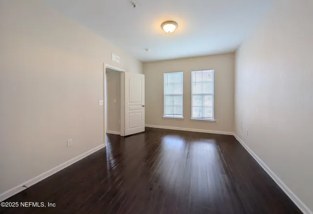 a bathroom with a sink a toilet and a large mirror