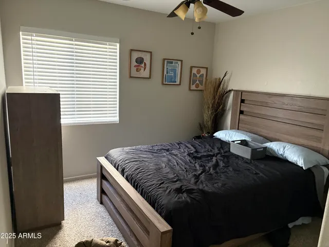 a view of a workspace with furniture and wooden floor