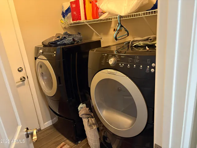 a view of a chairs and table in the patio