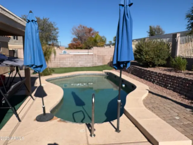a view of outdoor space and swimming pool