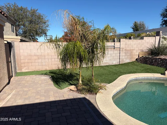 a view of a swimming pool with a patio