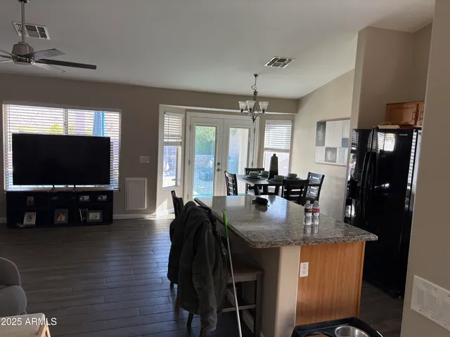 a dining room with furniture and window