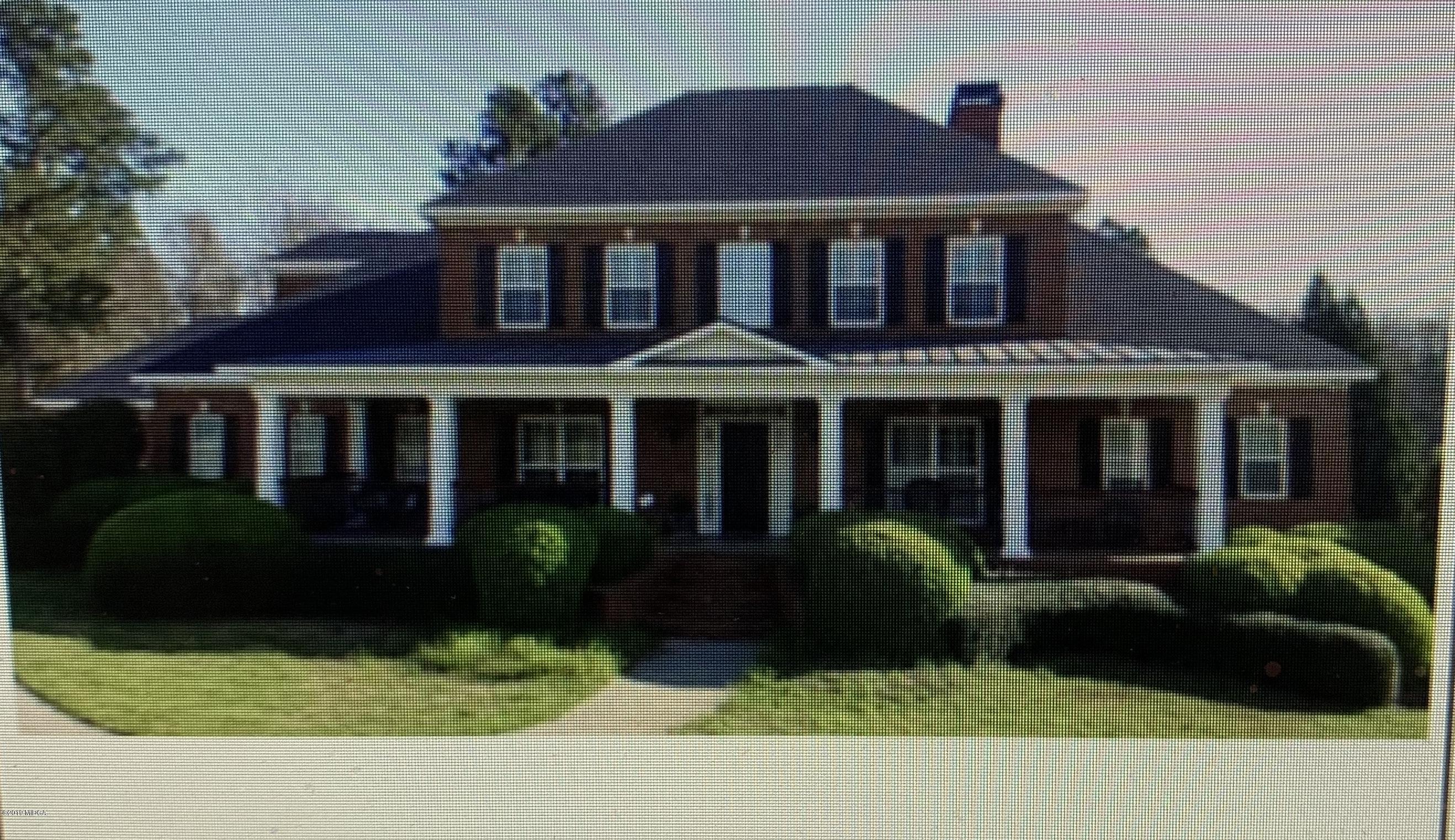 179 Spring Lake Road Gray, GA 31032 - Photo 1 of 1 a front view of a house with a garden