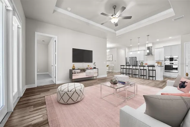 a living room with furniture and a flat screen tv