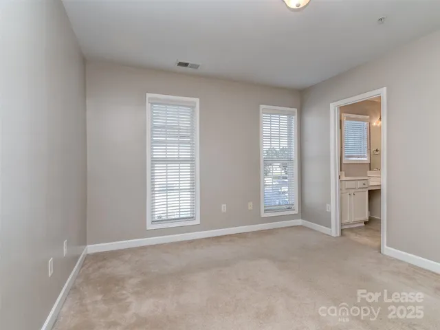 a bathroom with a sink toilet and a mirror