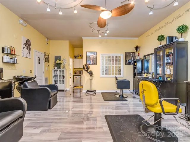 a view of a livingroom with furniture and a flat screen tv