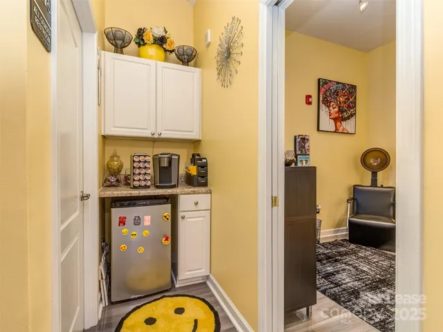 a bathroom with a toilet sink vanity and mirror