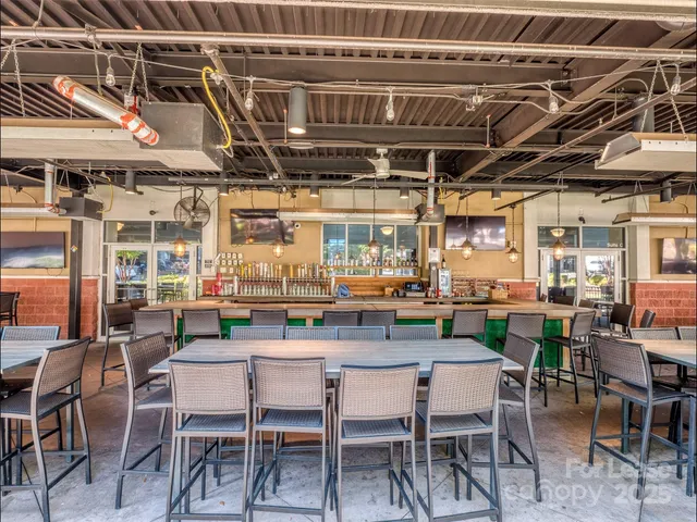 a front view of a house with a garden and plants