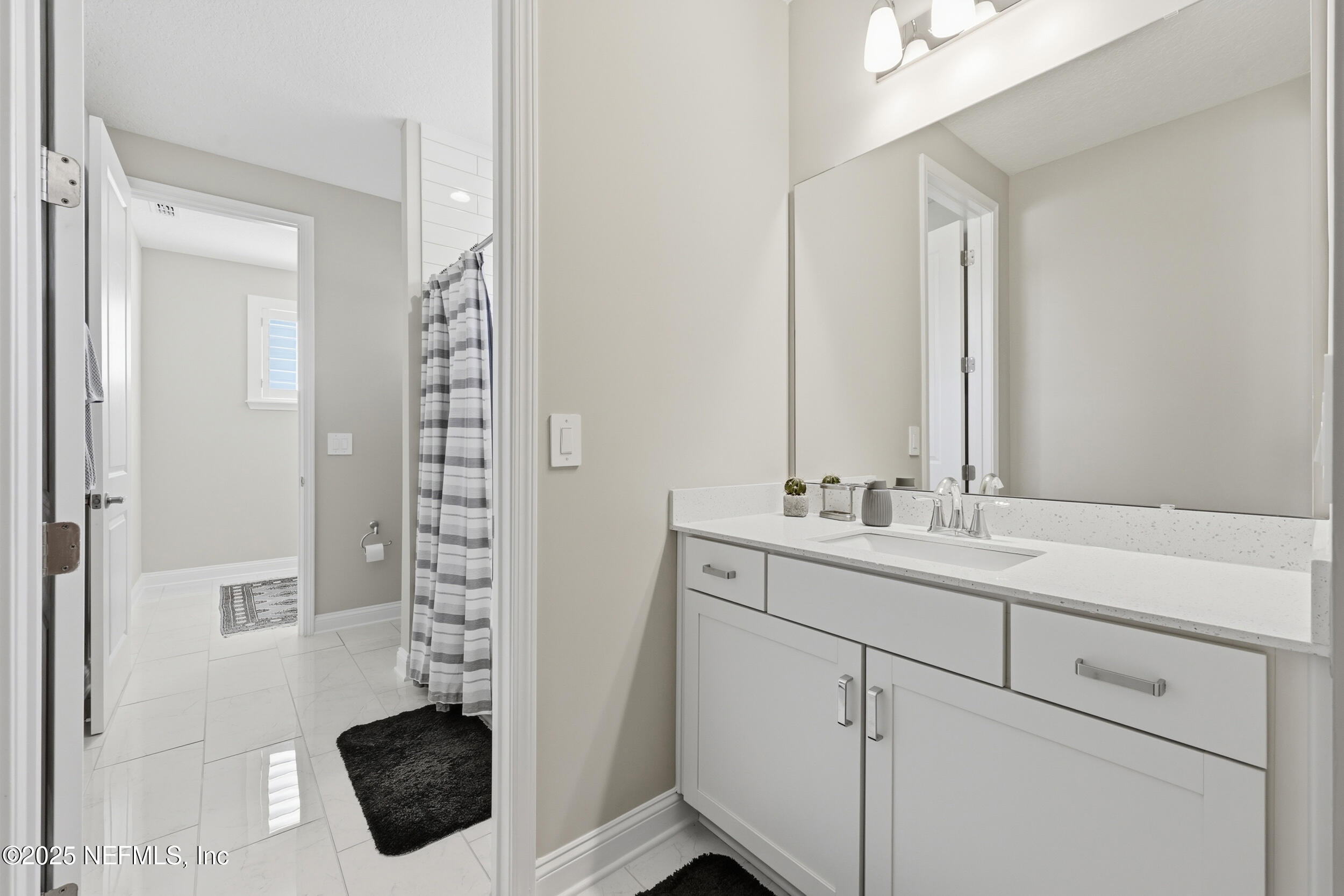 45 Rum Runner Way St. Johns, FL 32259 - Photo 23 of 50 a bathroom with a sink and a mirror