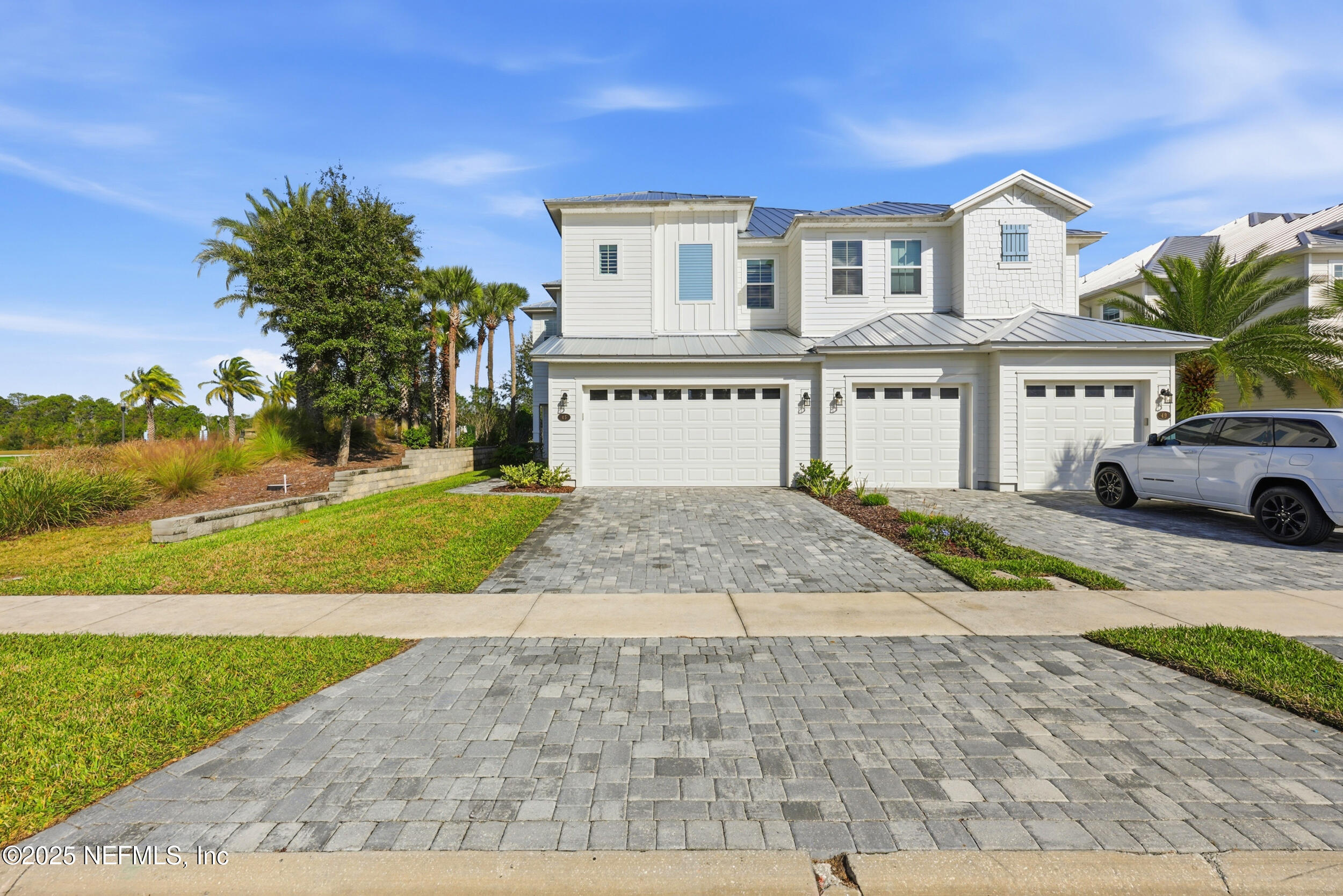 45 Rum Runner Way St. Johns, FL 32259 - Photo 34 of 50 a front view of a house with a yard and garage