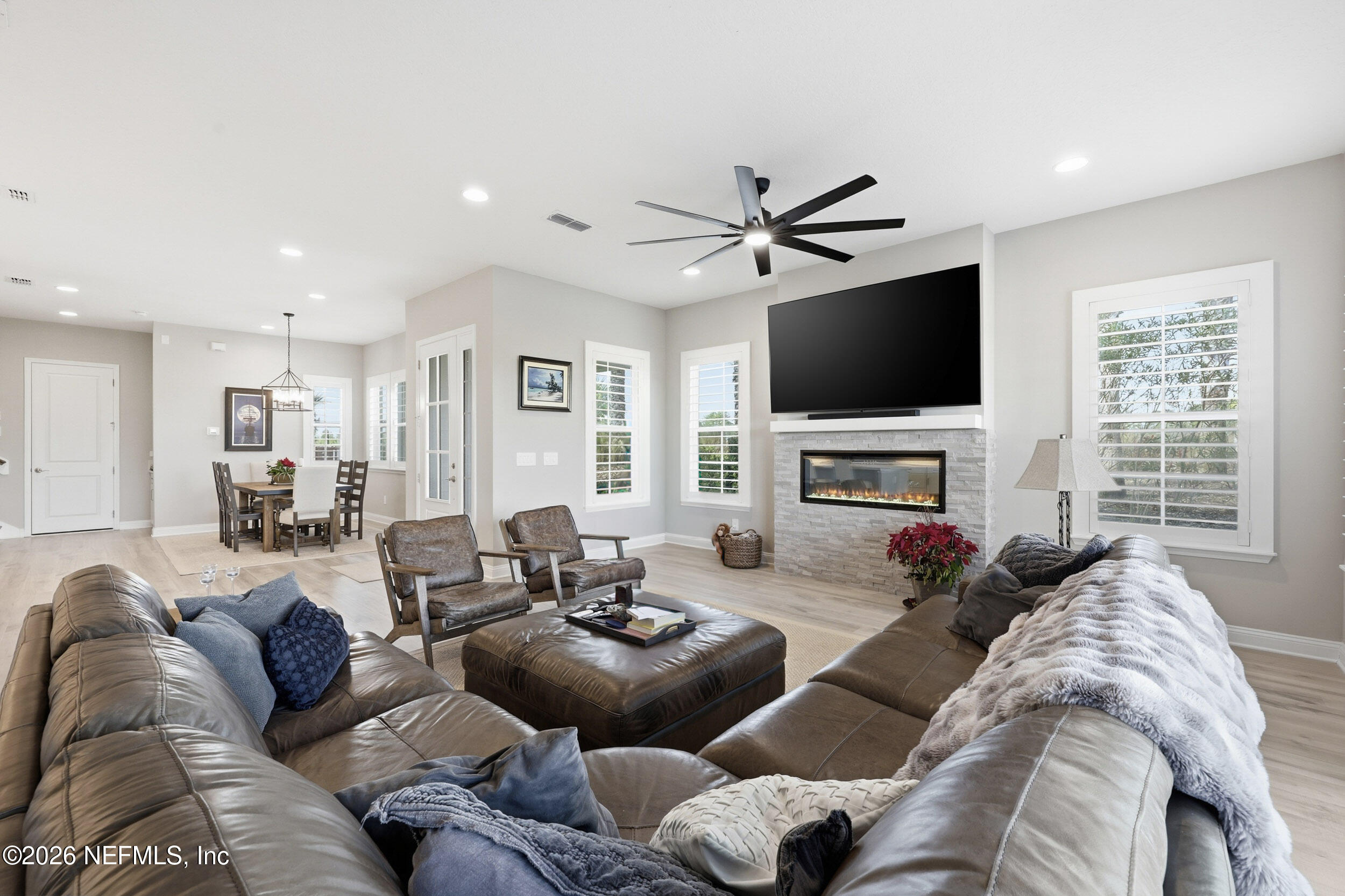 45 Rum Runner Way St. Johns, FL 32259 - Photo 50 of 50 a living room with furniture a fireplace and a flat screen tv