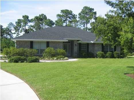 308 Shipwreck Road Santa Rosa Beach, FL 32459 - Photo 1 of 1 a front view of house with yard and green space