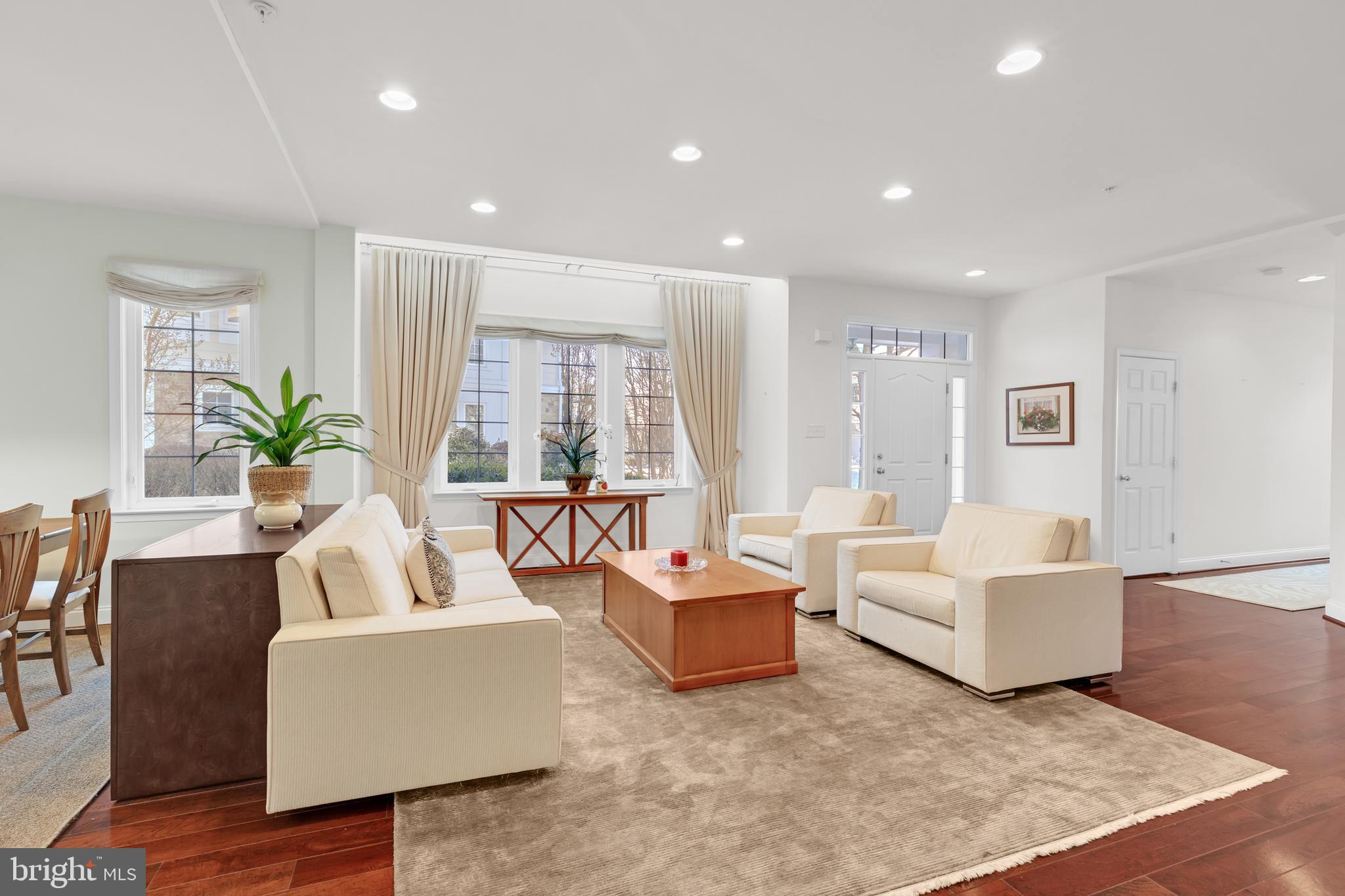8781 Endless Ocean Way, Unit 58 Columbia, MD 21045 - Photo 11 of 74 a living room with furniture and a large window