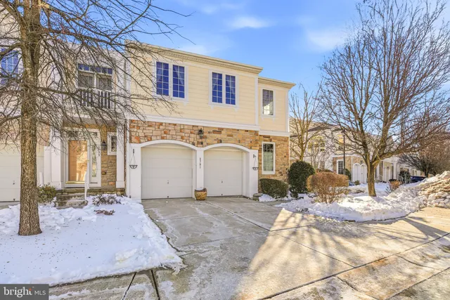 a view of a house with a snow in the yard