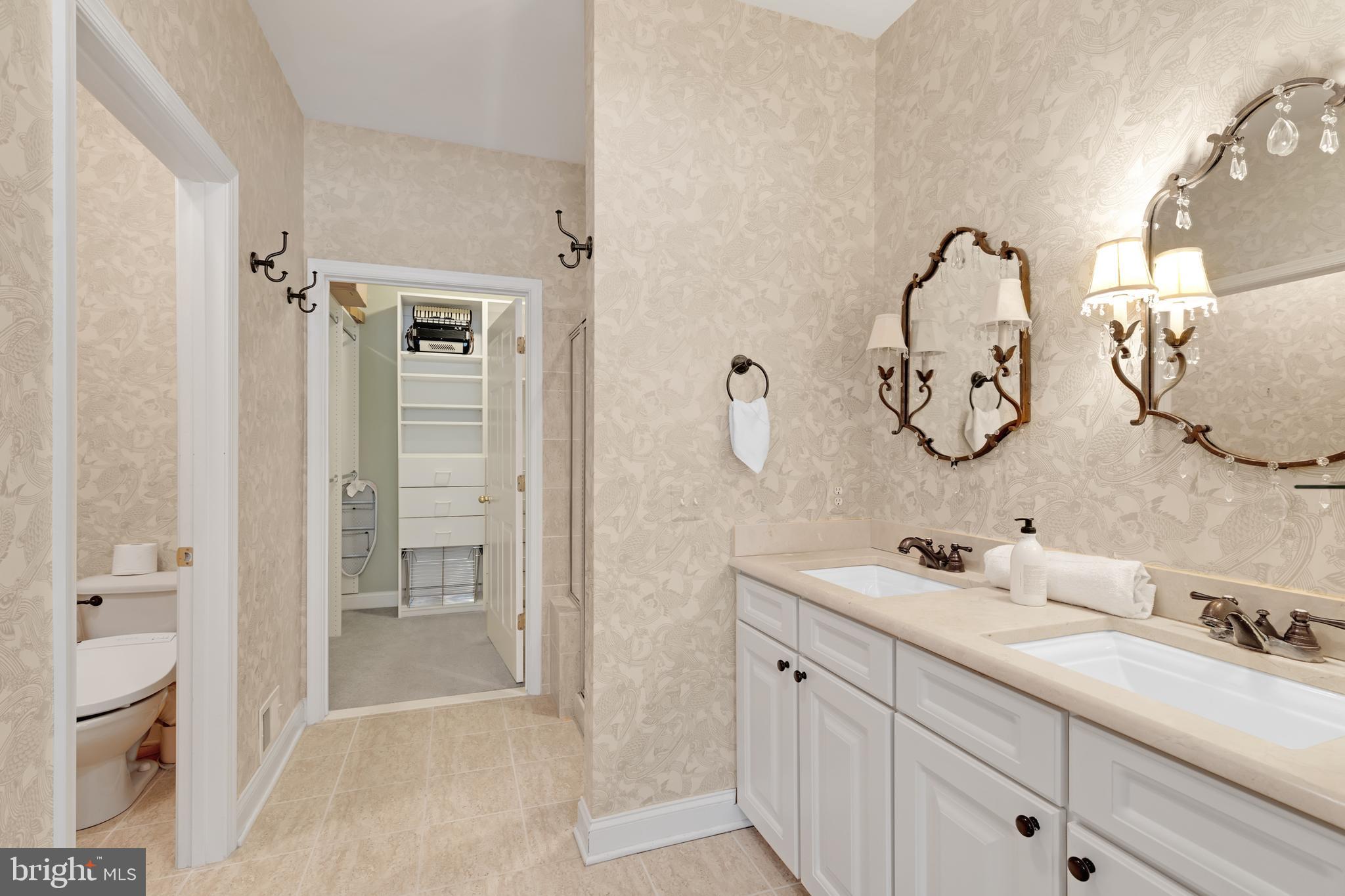 8781 Endless Ocean Way, Unit 58 Columbia, MD 21045 - Photo 24 of 74 a bathroom with a double vanity sink mirror and shower