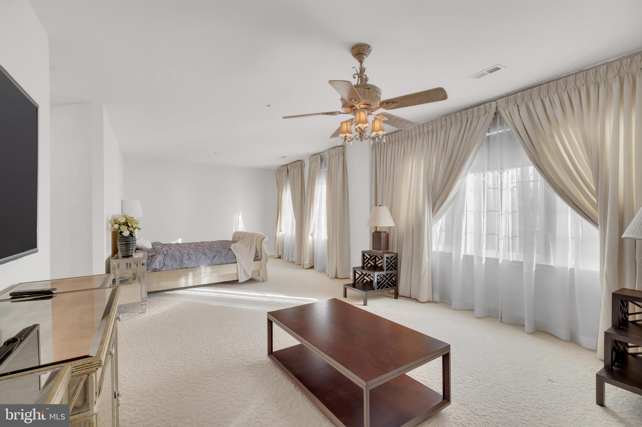 8781 Endless Ocean Way, Unit 58 Columbia, MD 21045 - Photo 36 of 74 a living room with furniture and a large window