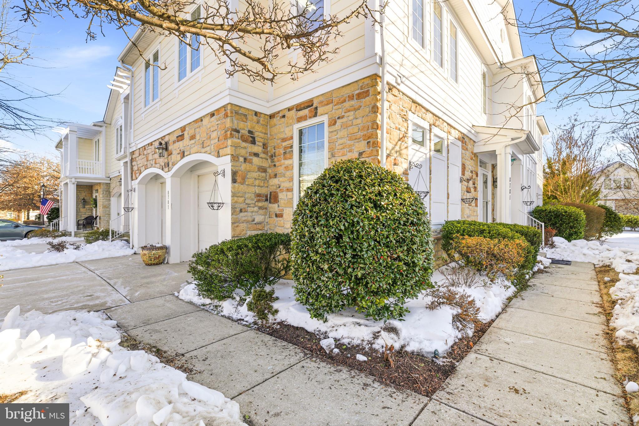 8781 Endless Ocean Way, Unit 58 Columbia, MD 21045 - Photo 4 of 74 a front view of a building with garden