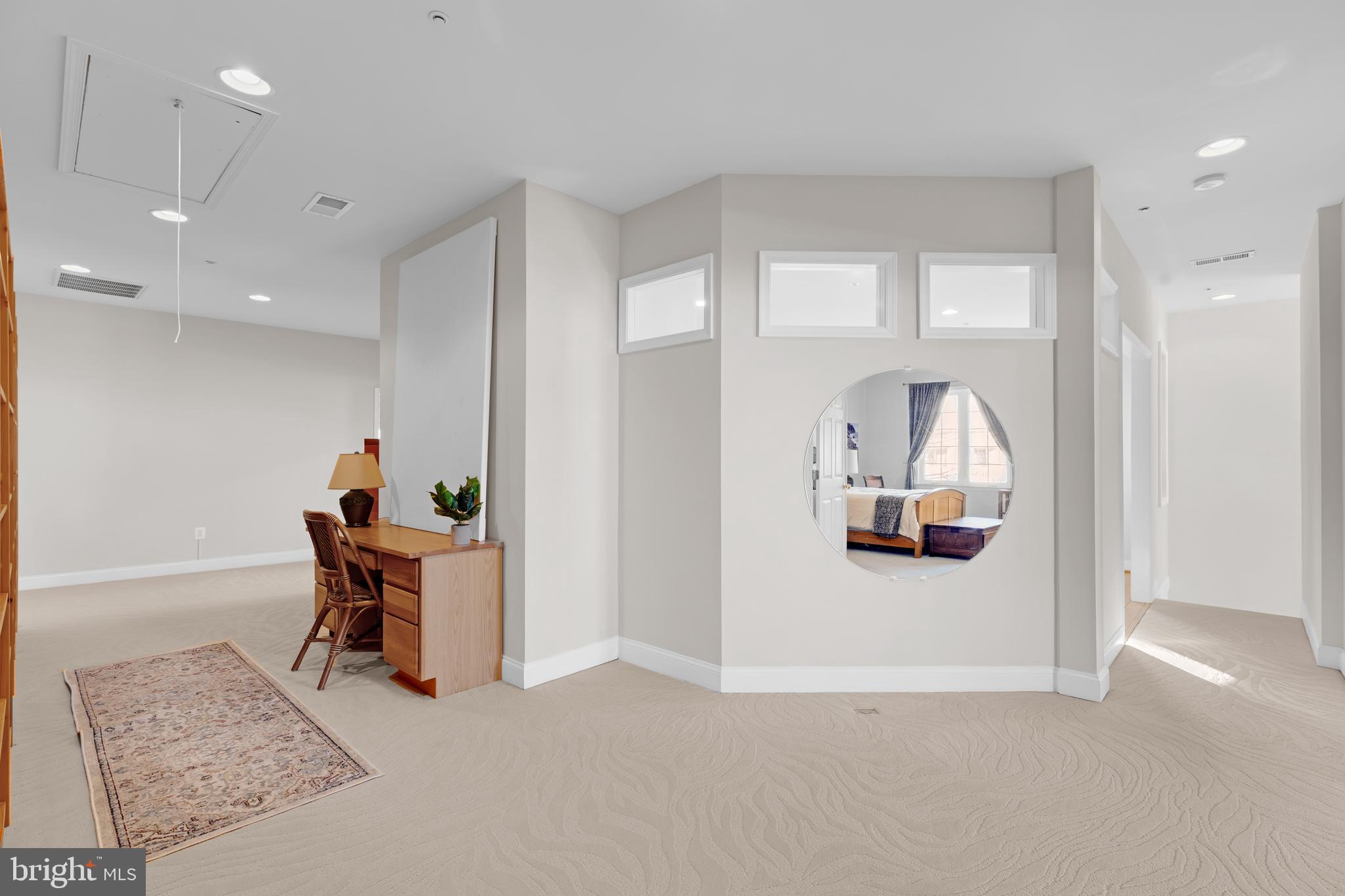 8781 Endless Ocean Way, Unit 58 Columbia, MD 21045 - Photo 42 of 74 a view of a hallway with dining room and wooden floor