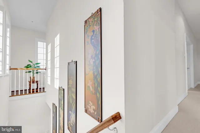 a view of a brick house with a potted plant and a large window