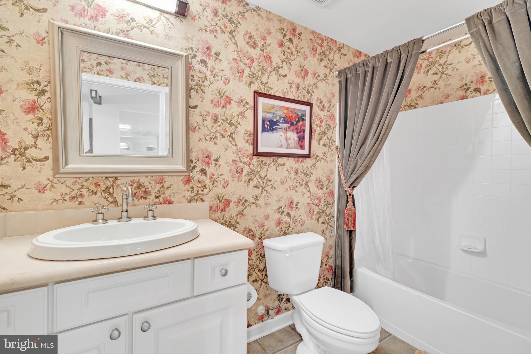 8781 Endless Ocean Way, Unit 58 Columbia, MD 21045 - Photo 59 of 74 a bathroom with a toilet sink and mirror