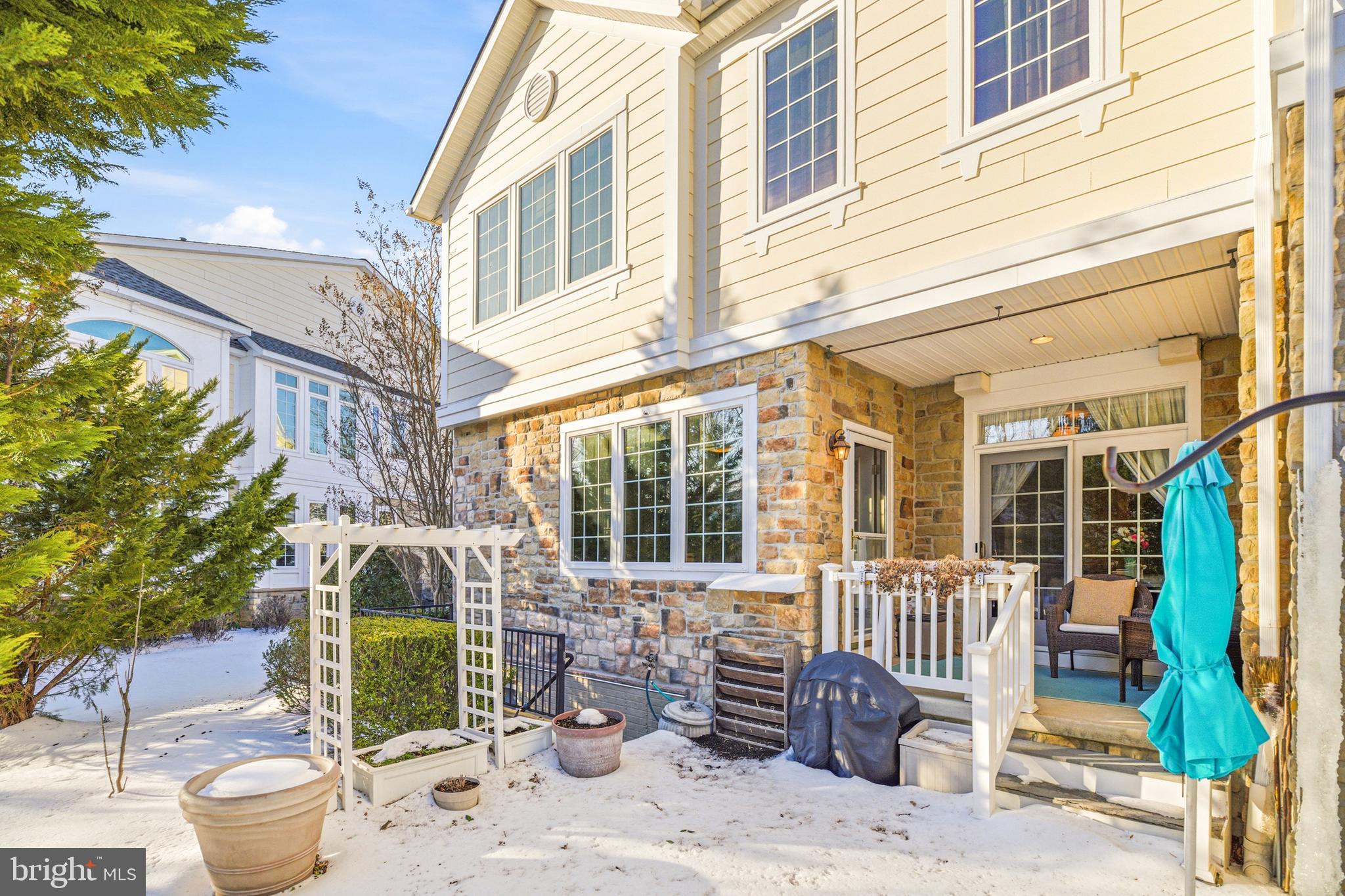 8781 Endless Ocean Way, Unit 58 Columbia, MD 21045 - Photo 63 of 74 a view of a patio with a chairs and table in a patio