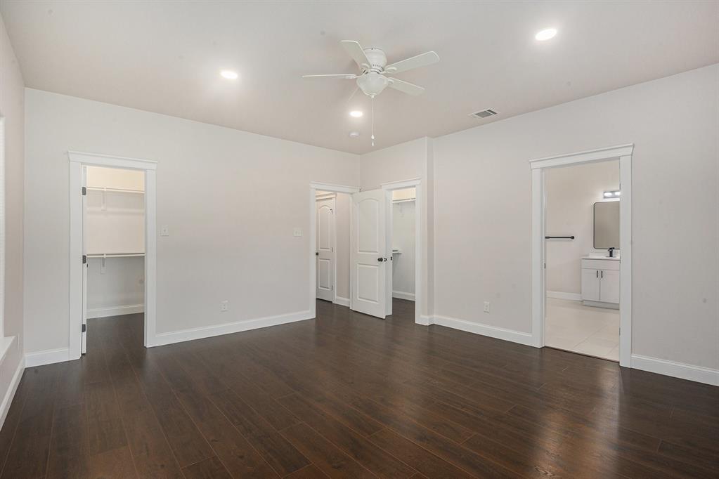 290 Aurora Street Rhome, TX 76078 - Photo 11 of 17 a view of an empty room with wooden floor