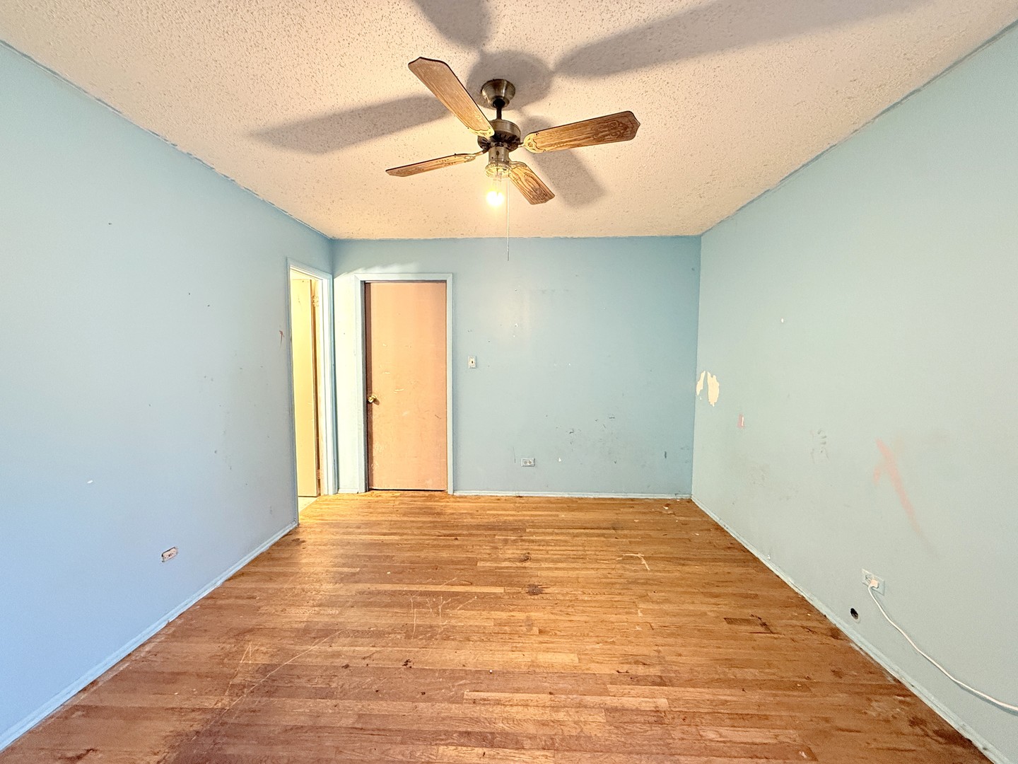 196 Green Court Streamwood, IL 60107 - Photo 6 of 18 a view of a room with a ceiling fan and window