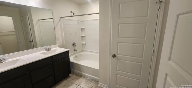 a bathroom with a white bath tub